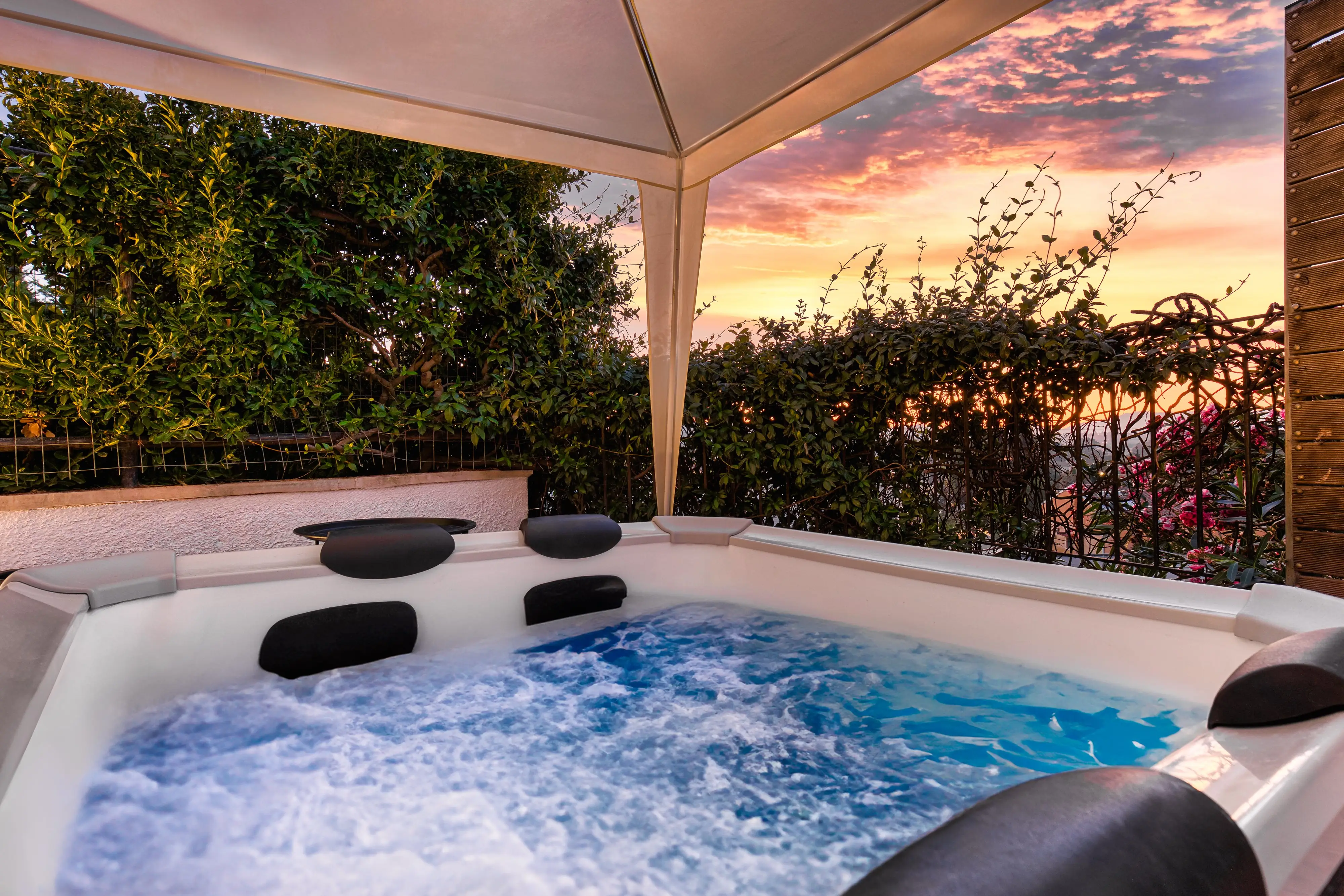 Jacuzzi with sunset sky
